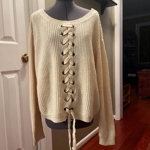 Tan sweater with lace-up front